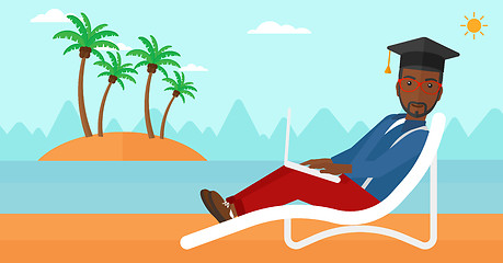 Image showing Graduate lying on chaise lounge with laptop.