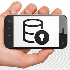 Image showing Software concept: Hand Holding Smartphone with Database With Lock on display