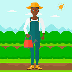 Image showing Farmer with watering can.