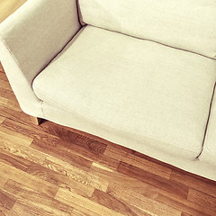 Image showing Simple white sofa on wooden floor