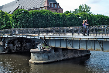 Image showing Family stand on Medovy Bridge. Kaliningrad.Russia