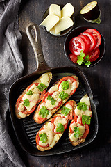 Image showing Baked eggplant with tomatoes and cheese