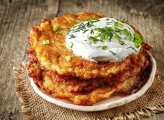 Image showing Potato pancakes on wooden table