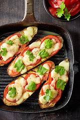 Image showing Baked eggplant with tomatoes and cheese