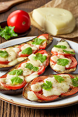 Image showing Baked eggplant with tomatoes and cheese