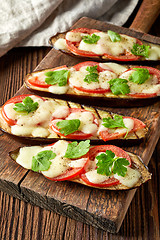 Image showing Baked eggplant with tomatoes and cheese
