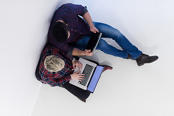 Image showing top view of  couple working on laptop computer at startup office