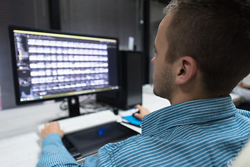 Image showing photo editor at his desk