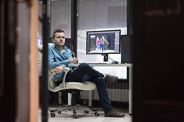 Image showing photo editor at his desk