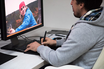 Image showing photo editor at his desk