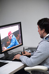 Image showing photo editor at his desk