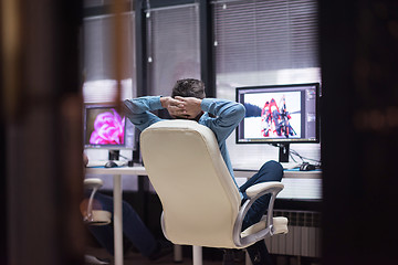 Image showing photo editor at his desk