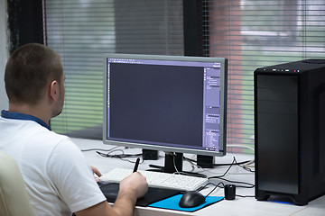 Image showing photo editor at his desk