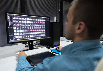 Image showing photo editor at his desk