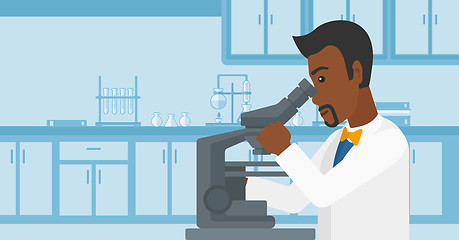 Image showing Laboratory assistant with microscope.