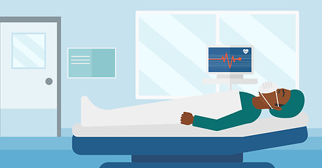 Image showing Patient lying in hospital bed with heart monitor.