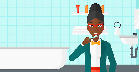 Image showing Woman brushing teeth.