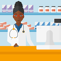 Image showing Pharmacist at counter with computer monitor.