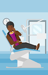 Image showing Man suffering in dental chair.