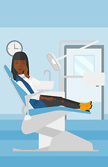 Image showing Woman suffering in dental chair.