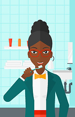 Image showing Woman brushing teeth.