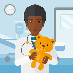 Image showing Pediatrician holding teddy bear.