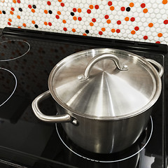 Image showing Metal saucepan on a stove