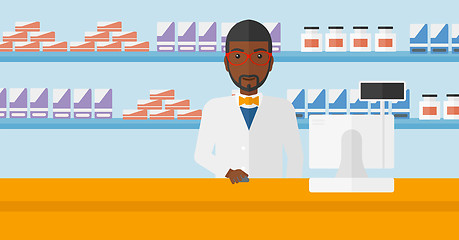 Image showing Pharmacist at counter with computer monitor.