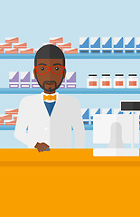 Image showing Pharmacist at counter with computer monitor.