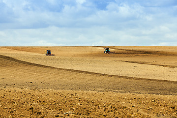 Image showing tractor plowing the fields  