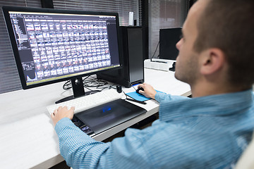 Image showing photo editor at his desk