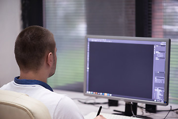 Image showing photo editor at his desk