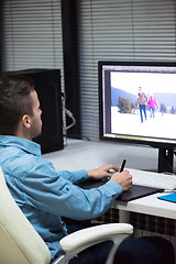 Image showing photo editor at his desk