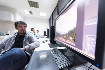 Image showing photo editor at his desk