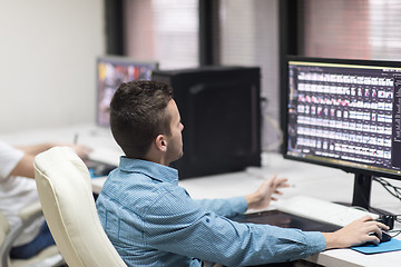 Image showing photo editor at his desk