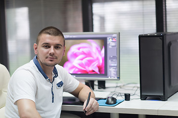 Image showing photo editor at his desk