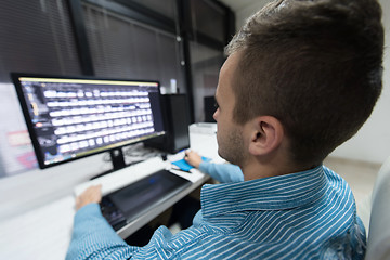 Image showing photo editor at his desk