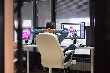 Image showing photo editor at his desk