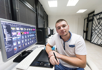 Image showing photo editor at his desk