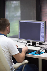 Image showing photo editor at his desk