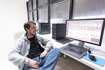 Image showing photo editor at his desk