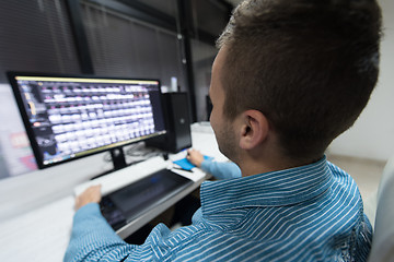 Image showing photo editor at his desk