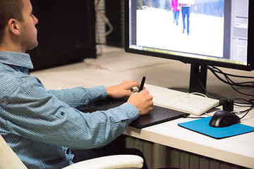 Image showing photo editor at his desk