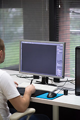 Image showing photo editor at his desk