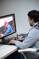 Image showing photo editor at his desk