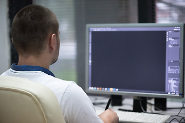 Image showing photo editor at his desk