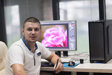 Image showing photo editor at his desk