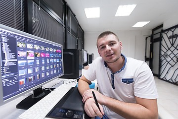 Image showing photo editor at his desk