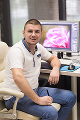 Image showing photo editor at his desk