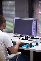 Image showing photo editor at his desk